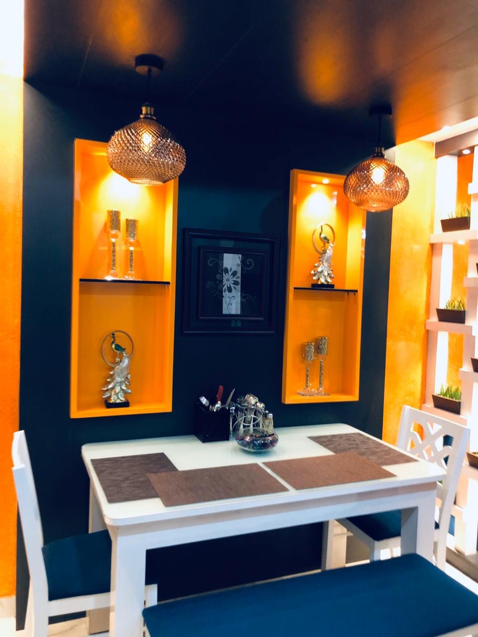 Dining area wall with warm niches