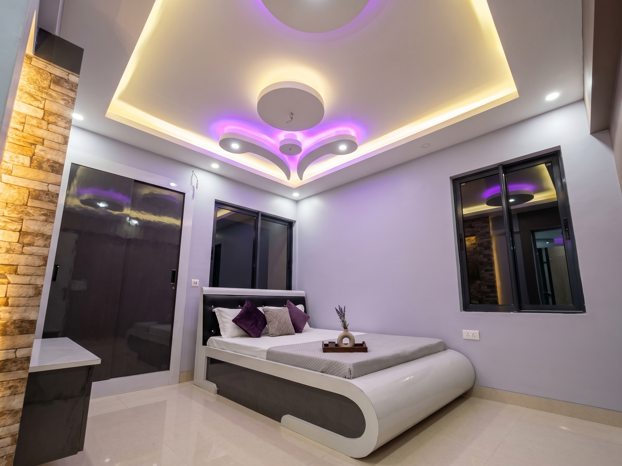 Master bedroom with ceiling lighting